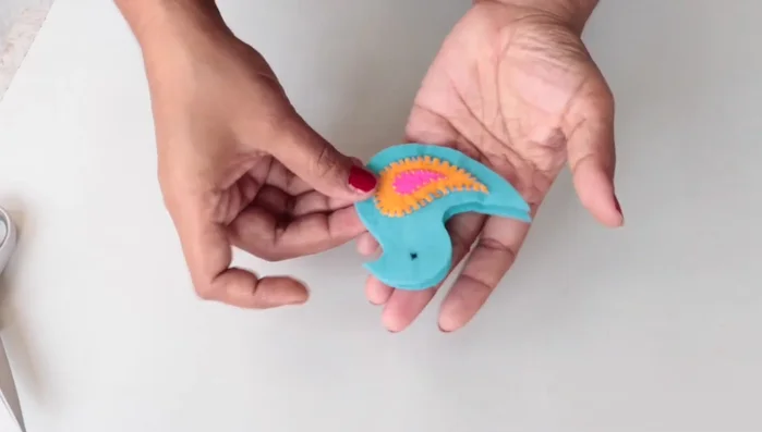 Stitch the two body pieces together, leaving a small opening for stuffing.