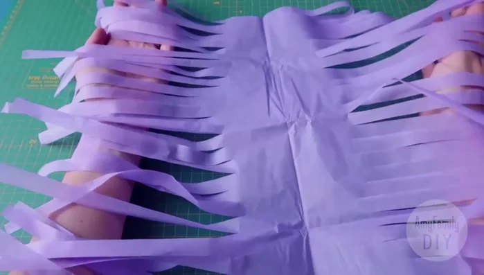 Fold the tassel in half and secure it with glue.