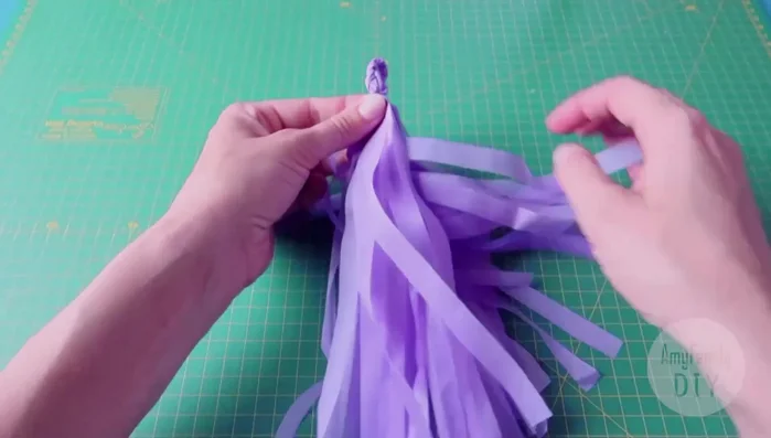 Fold the tassel in half and secure it with glue.
