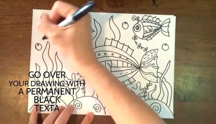 Outline all the drawings with a black marker.