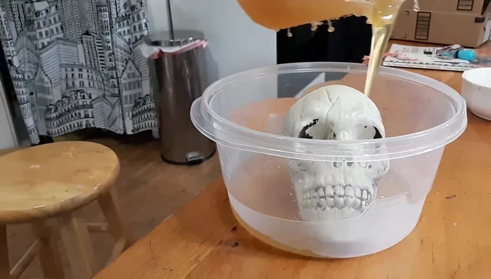 Cool and demold: Let the composite mold cool for 4-5 hours. Carefully remove the mold from the mold box and peel away the composite mold from the skull.