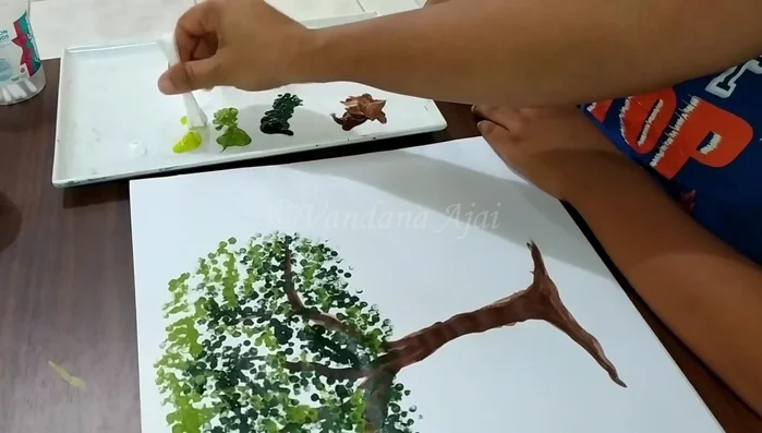 Add lightest green leaves using Q-tips, ensuring leaves are not overcrowded.