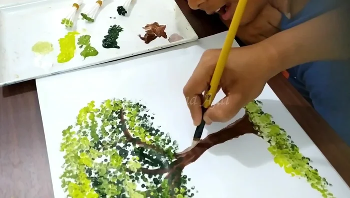 Paint tree trunk details using a brush with a mix of white and burnt umber.