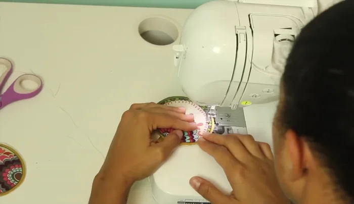 Stitch around the entire circle to secure the loop and raw edges. Use a tight zigzag stitch.