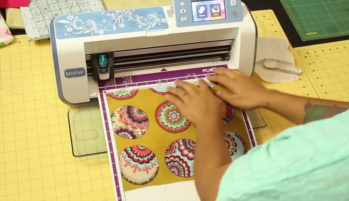 Prepare your fabric. Stick the fabric onto your cutting mat and press the load mat button.