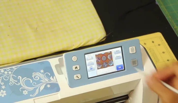 Select 'cut' and 'set start'. The machine will cut your shapes. Peel off the excess fabric.