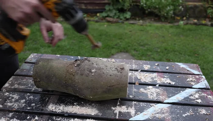 Drill a hole in the front of the body log for the neck.