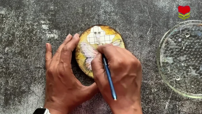 Apply a transfer sheet (e.g., with a 'be happy' design) using water to add another decorative layer.