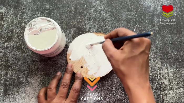 Prepare the coaster base by applying a thick coat of white gesso.
