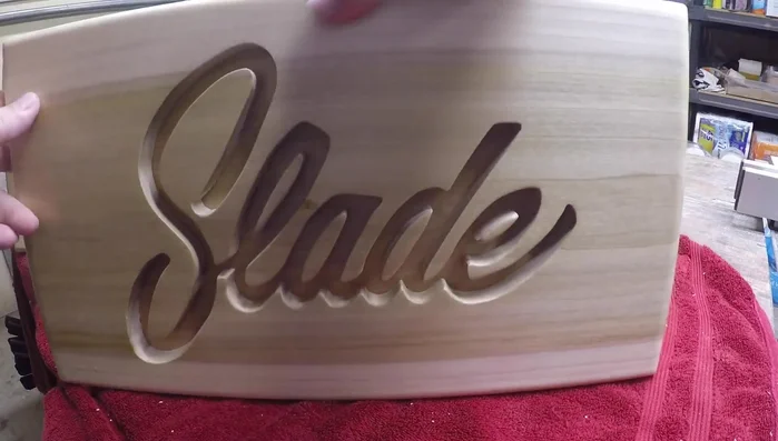 Add a hanger to the back of the plaque.