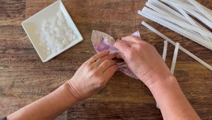 Add optional pearlized embellishments with hot glue to the center.