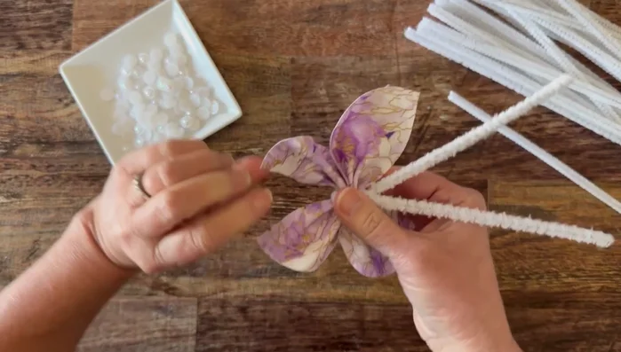 Add optional pearlized embellishments with hot glue to the center.