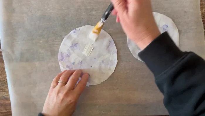 Glue the Mod Podge-coated halves of the circles together, print sides facing out. Let it dry.