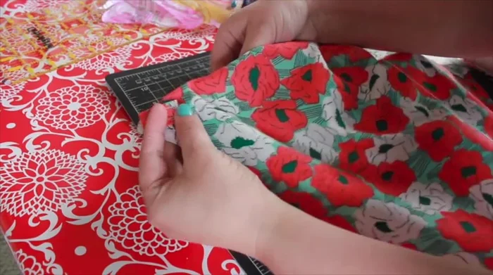 Attach the string, clipping it higher towards the top for better lift.