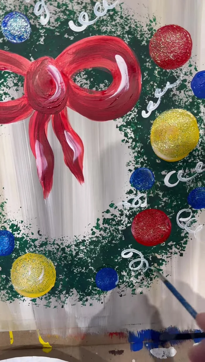 Use a detail brush and white paint to add squiggly lines resembling tinsel or streamers for extra festiveness. Add half-C shapes to the ornaments for shine.