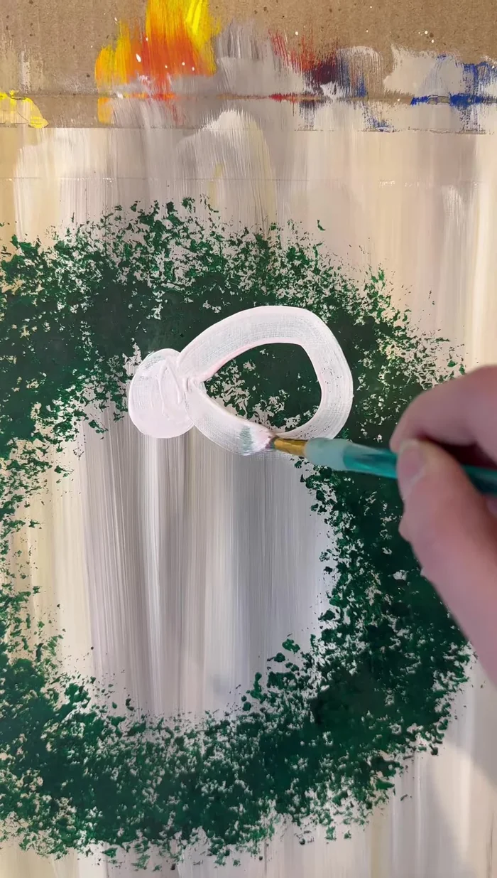 Add highlights to the bow with white paint.