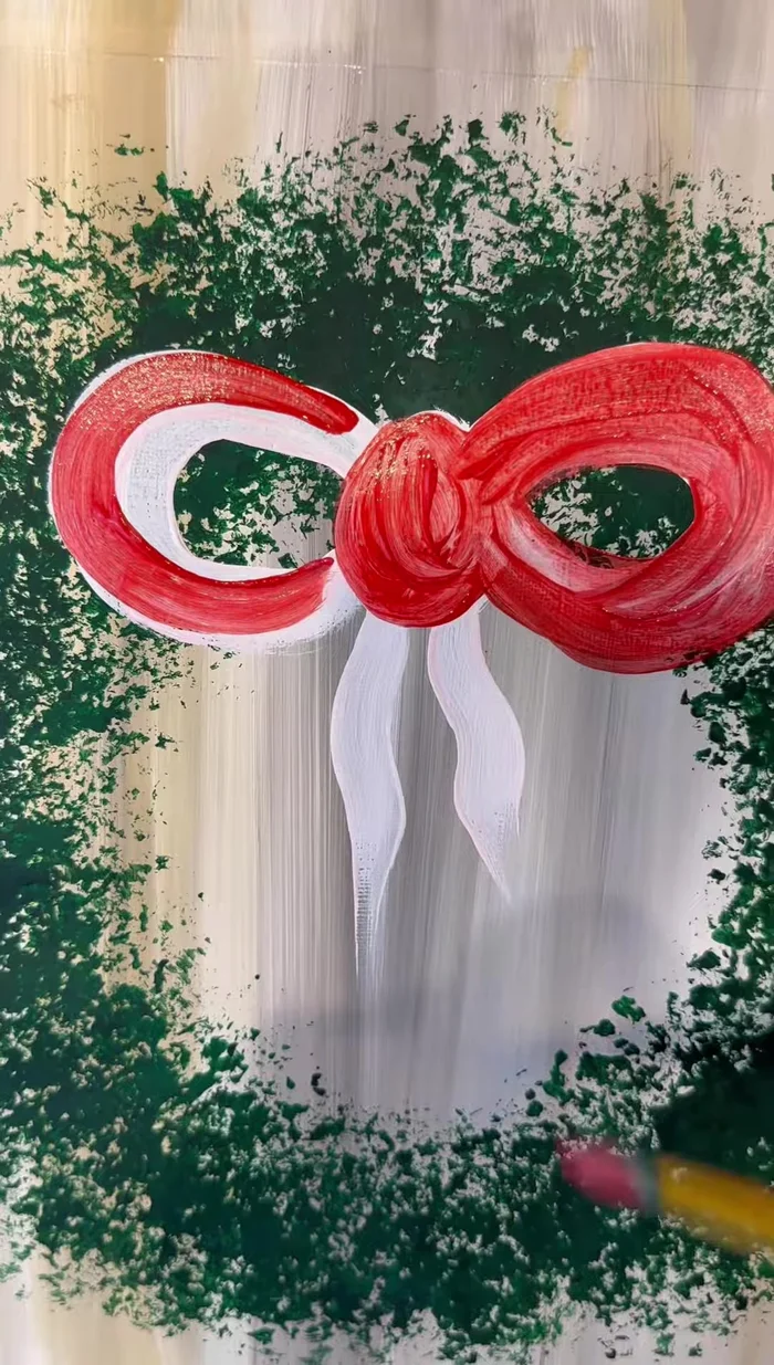 Add highlights to the bow with white paint.