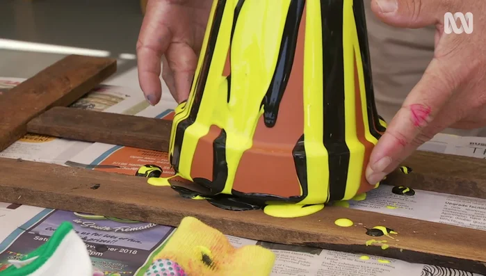 Shift the pots out of paint puddles before it dries.