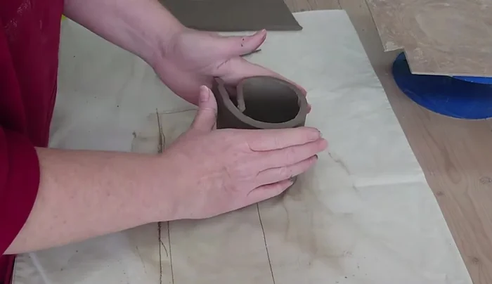 Trim a piece of clay for the mushroom base, creating a slightly wider circle than the height of the mushroom.