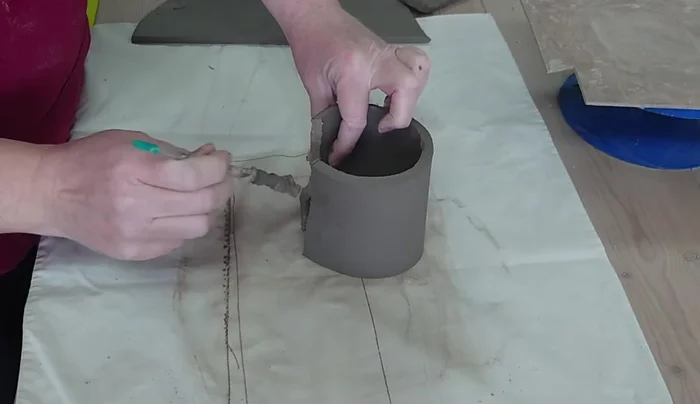 Add small clay pieces around the base to reinforce the join and add texture.
