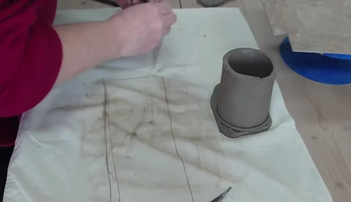 Add small clay pieces around the base to reinforce the join and add texture.