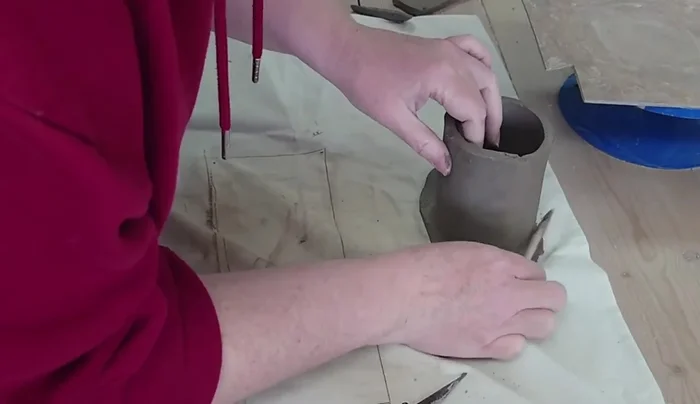 Add small clay pieces around the base to reinforce the join and add texture.