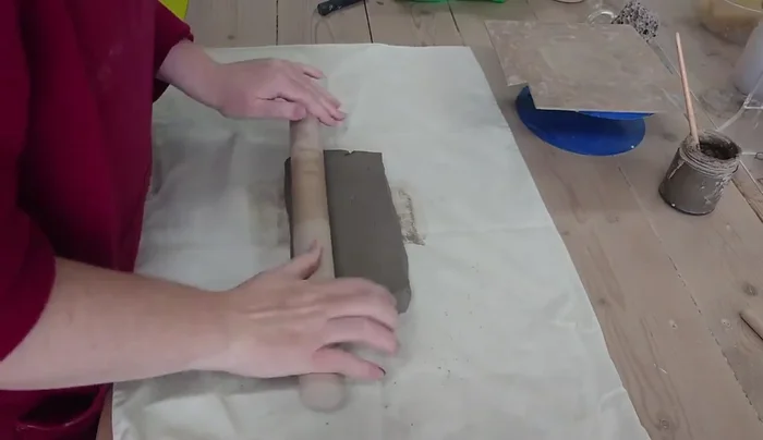Trim a piece of clay for the mushroom base, creating a slightly wider circle than the height of the mushroom.