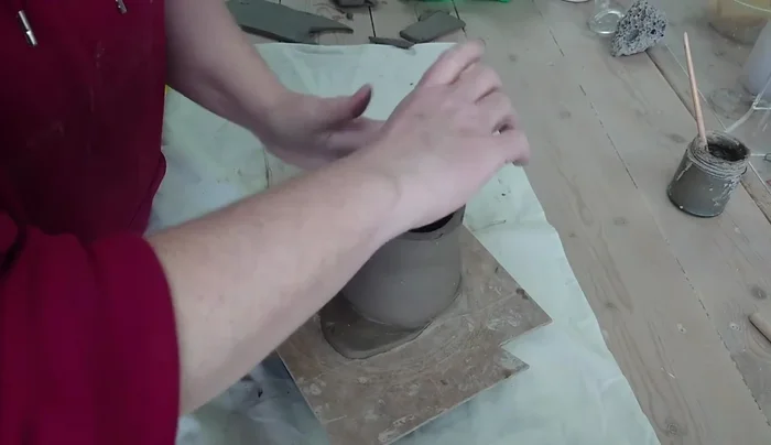 Create and attach small decorative elements, such as baby mushrooms and a doorway.