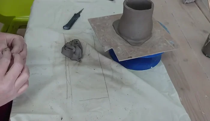 Create and attach small decorative elements, such as baby mushrooms and a doorway.