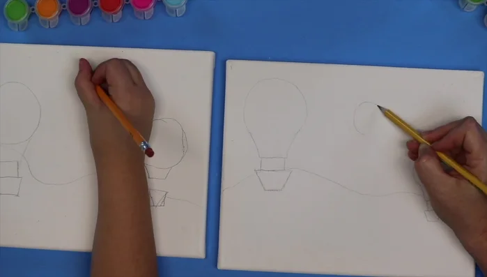 Draw the smallest hot air balloon in the background, making it appear furthest away.