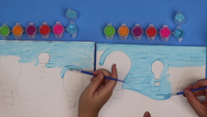 Paint the grass green, using horizontal strokes and carefully blending the green with the blue horizon line.