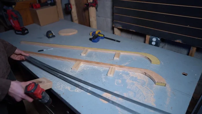 Attach the steel to the supports using nails.