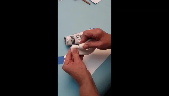 Prepare Model Magic: It's stretchy and sticks to itself. If stuck, reform into a ball and start over. Keep unused clay in a plastic bag to prevent drying.