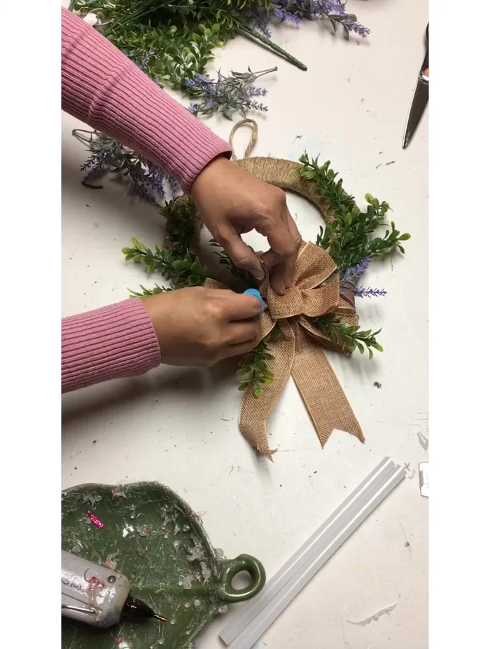 Add lavender flowers to the wreath.