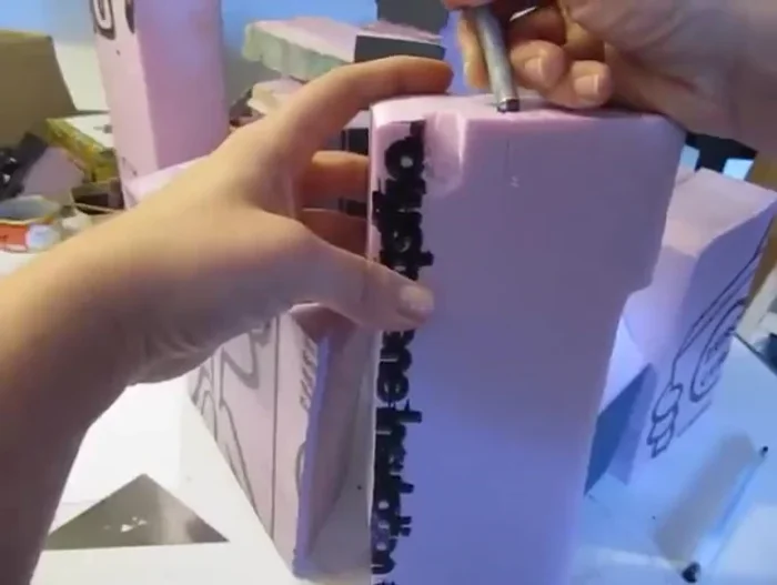 Create additional details, like balconies and windows, using foam cutouts. Glue them onto the main structure.