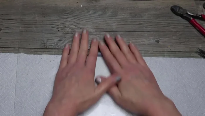 Make a worm: Add clay to floral wire, create a slightly larger head, add rings, and bend into shape.