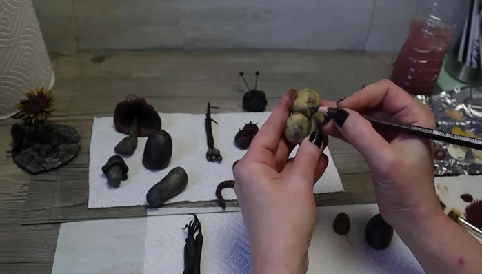 Add speckles using a toothbrush. Add a layer of resin to make them waterproof.