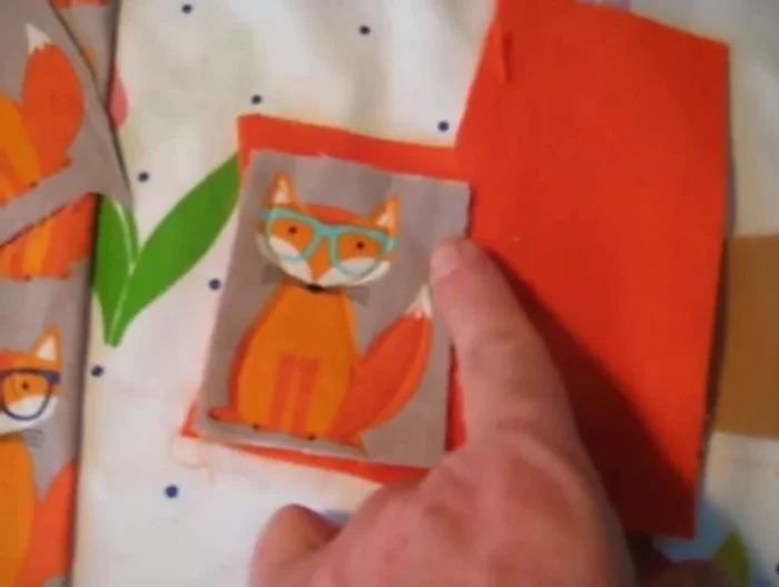 Carefully cut around the outer edge of the finished piece, trimming close to the stitching but not cutting the stitching itself.