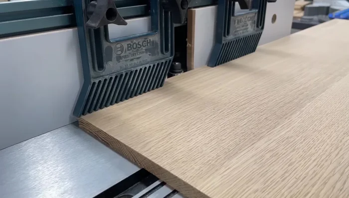 Cut a rabbet on all four sides of the center panels to slide into the grooves of the frames.