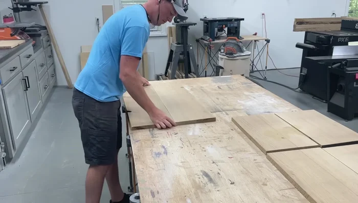 Glue up panels for all four sides of the box, pairing pieces from the same board and rotating them for seamless grain. Flatten and square one face and edge using the jointer and planer. (Pre-milled lumber is an alternative).