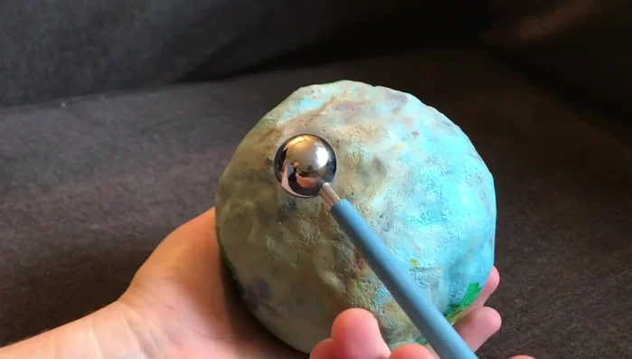 Use a ball tool (or similar sculpting tool) to create additional indentations and craters for added realism.