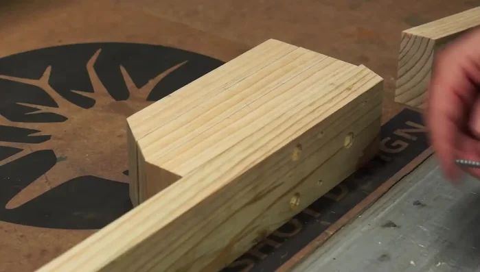 Assemble the new tractor body using wood glue and coat screws to ensure strength and prevent sliding.