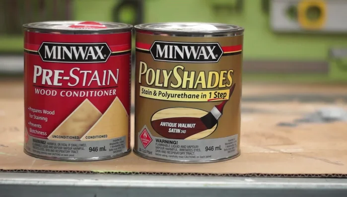 Apply pre-stain conditioner and multiple coats of walnut stain, followed by gloss clear coat.