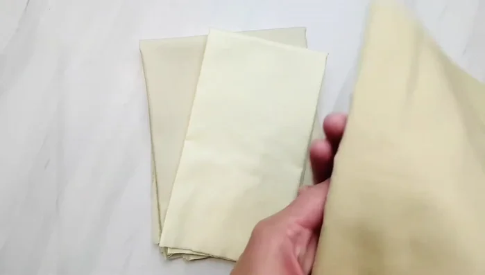 Cut out the pattern pieces from your chosen fabric. If adding hair, the back of the doll head should be the same color as the hair.