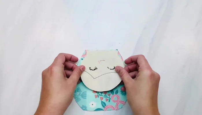 Sew the back of the doll head to the doll body, leaving a gap in the middle for stuffing. Only sew about an inch on each side to secure it.