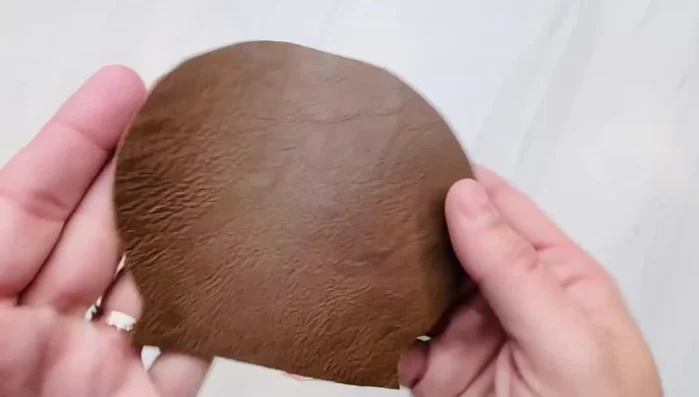 Sew the back of the doll head to the doll body, leaving a gap in the middle for stuffing. Only sew about an inch on each side to secure it.