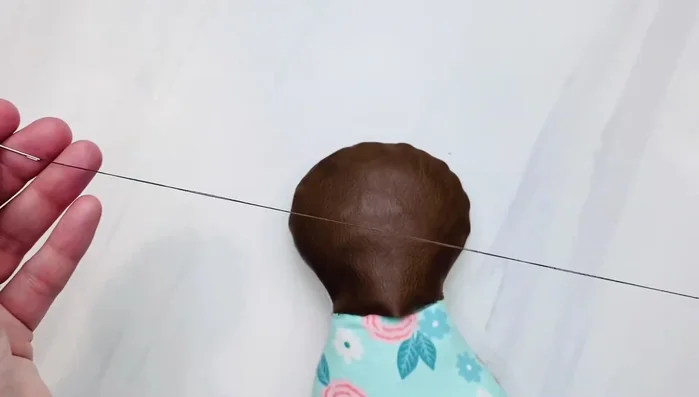 Close the opening at the back using a ladder stitch. (Tutorial link provided)