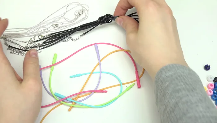 Select cords and beads for necklaces/bracelets. 