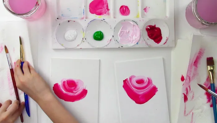 Use a round brush to smooth out any rough edges and add shading with pink and white.