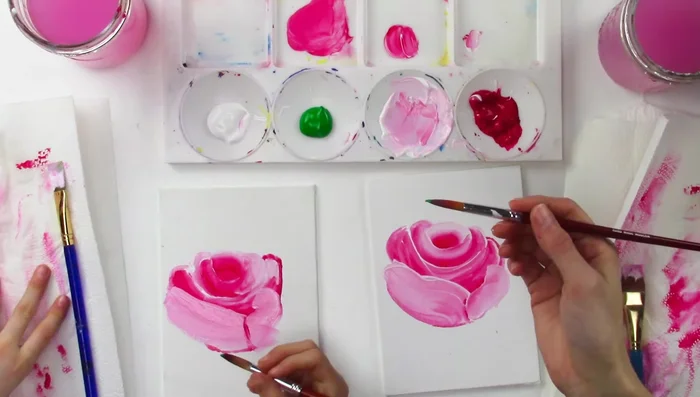 Add the stem and leaves using green paint, mixing in red and white to create variations in color and texture.